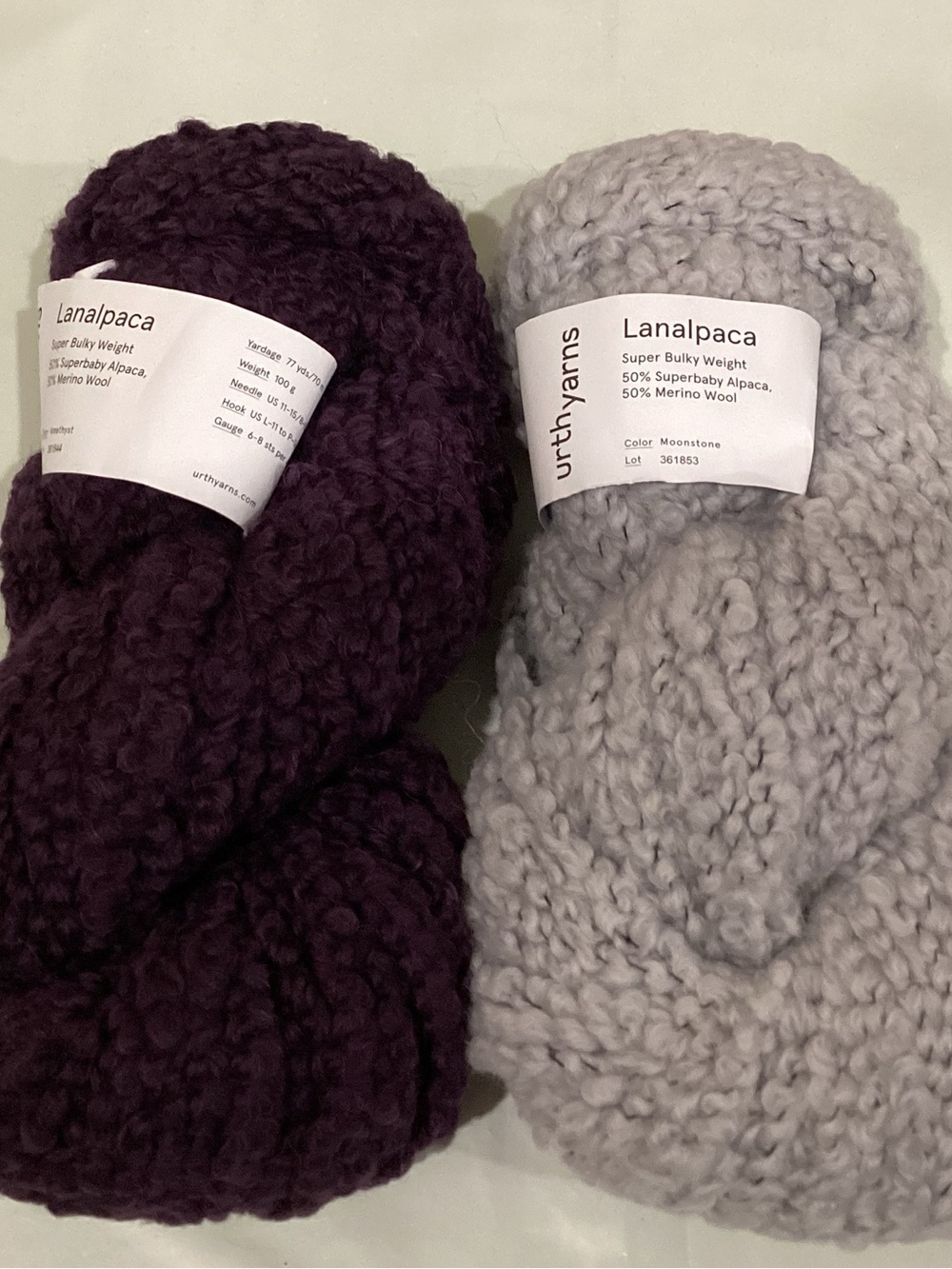 2 hanks of Urth Yarns Lanalpaca yarn in colorways moonstone and amethyst